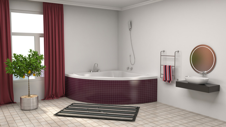 Maroon tiled tub bathroom