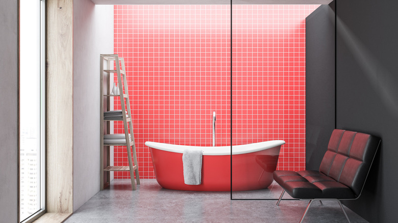 Red bathtub and tile wall