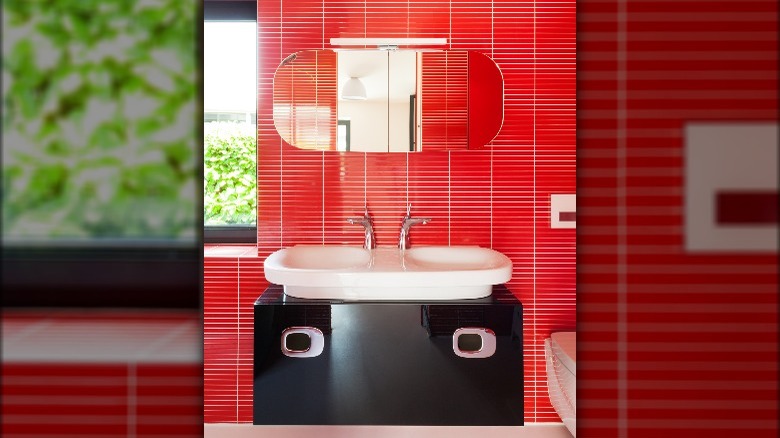 Red tile walls black sink 