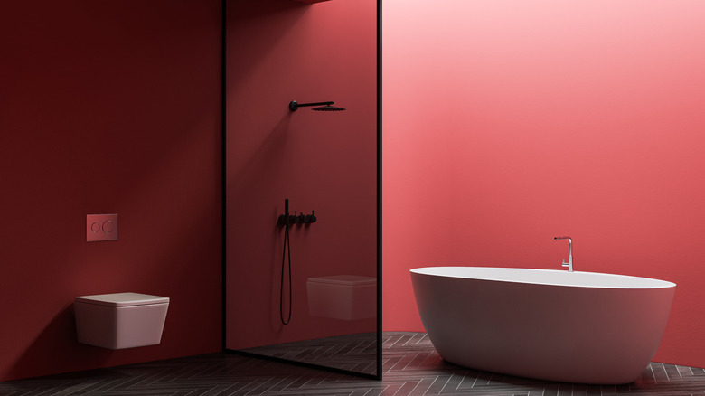 Red bathroom walls white tub