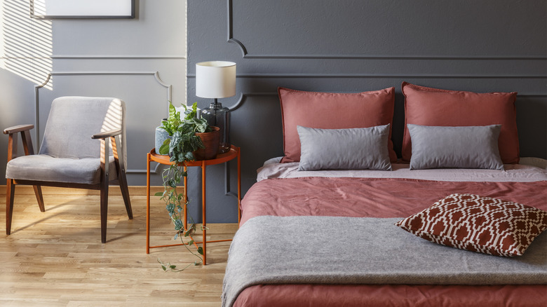 red bedding in a gray bedroom