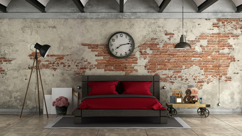 red bedding in industrial bedroom