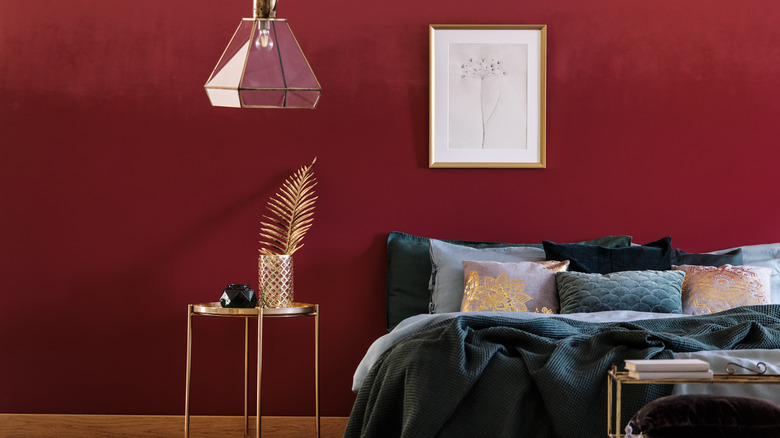 red bedroom with dark bedding