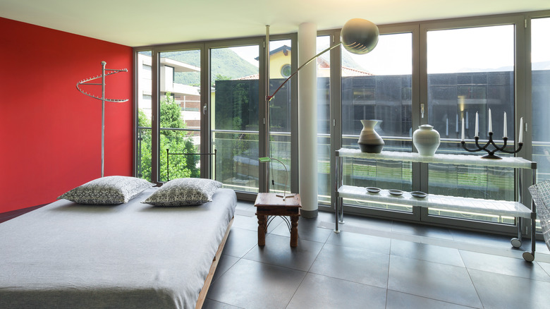 large windows in red bedroom