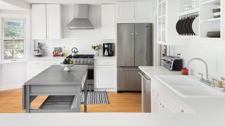 White and grey kitchen with island