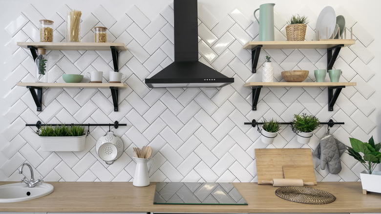 Floating shelves flanking stove range