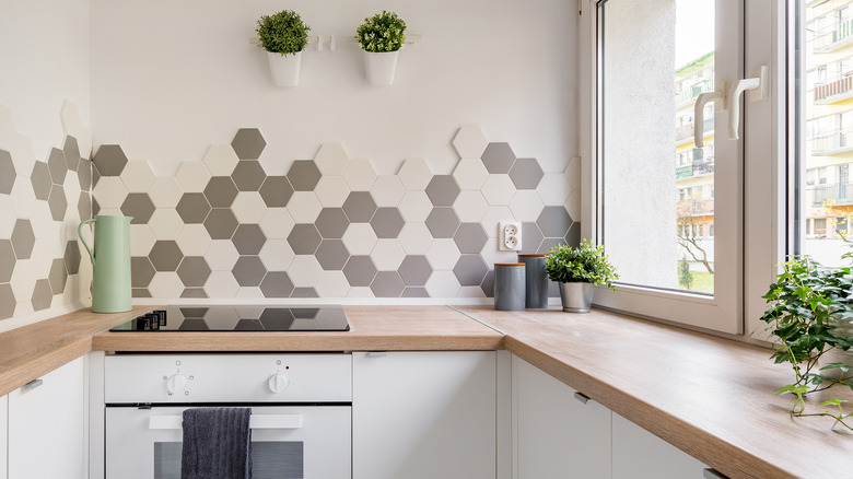 Small kitchen with gray and white backsplash