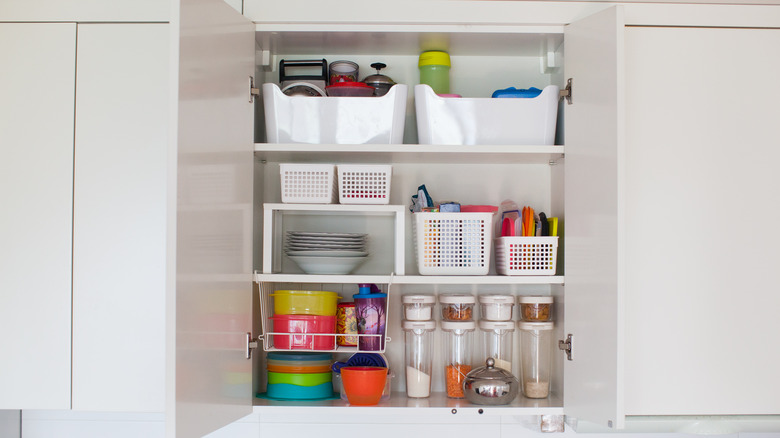 Kitchen ware organized in cabinet