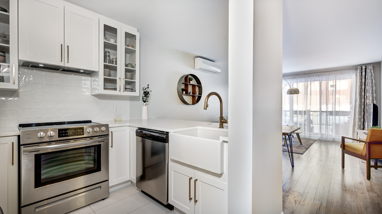 White kitchen open to living room