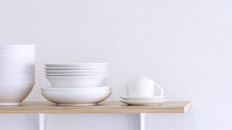 White dinnerware on shelf