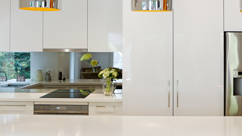 Modern kitchen with mirrored backsplash