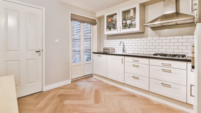 White kitchen with shallow cabinets