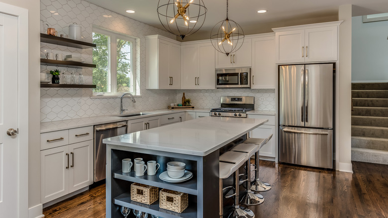 White kitchen with blue island