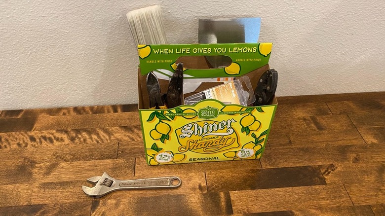 Beer box with tools and nails