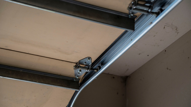 Garage door track and roller system