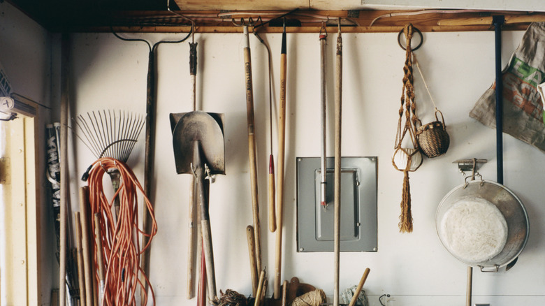 Gardening tools hanging in a garage