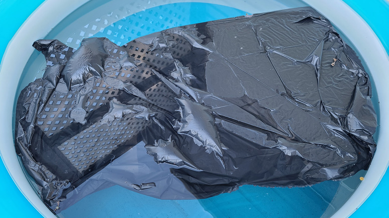 garbage bag on a pool