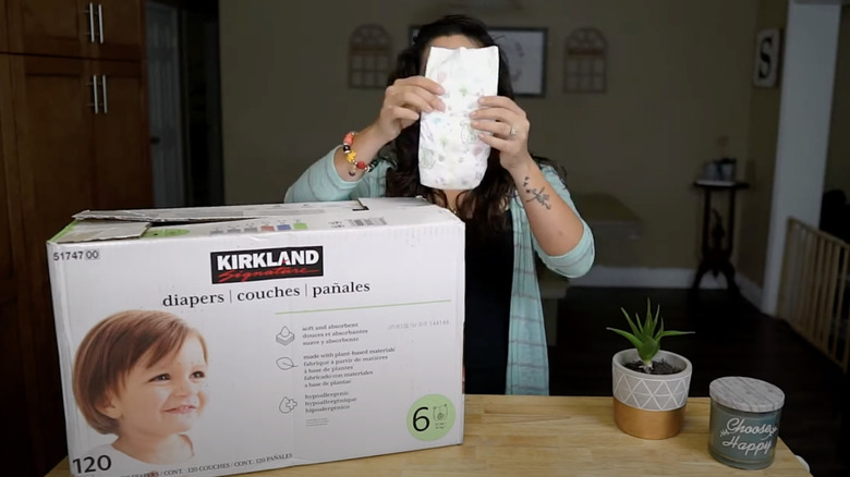 woman reviewing Kirkland Signature diapers