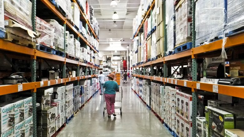 woman shopping in costco aisle