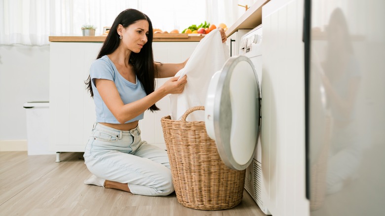 woman doing stinky laundry