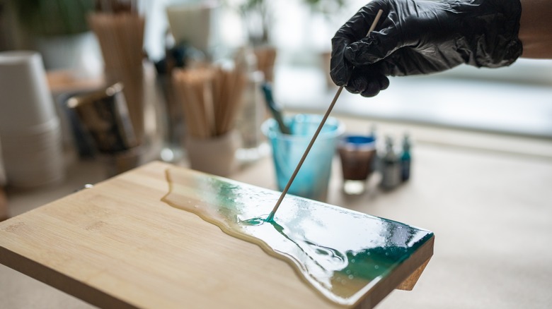 person working with epoxy resin