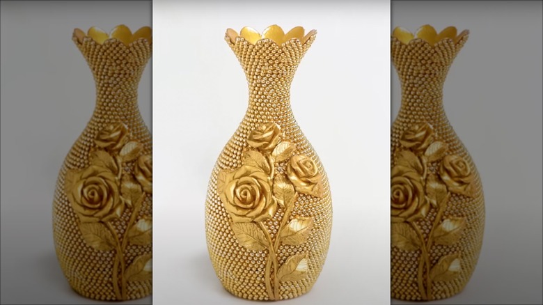 Ornate plastic bottle vase