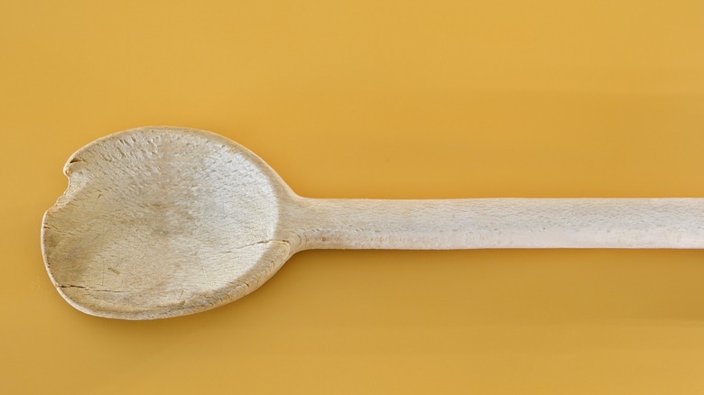 old and cracked wooden spoon 