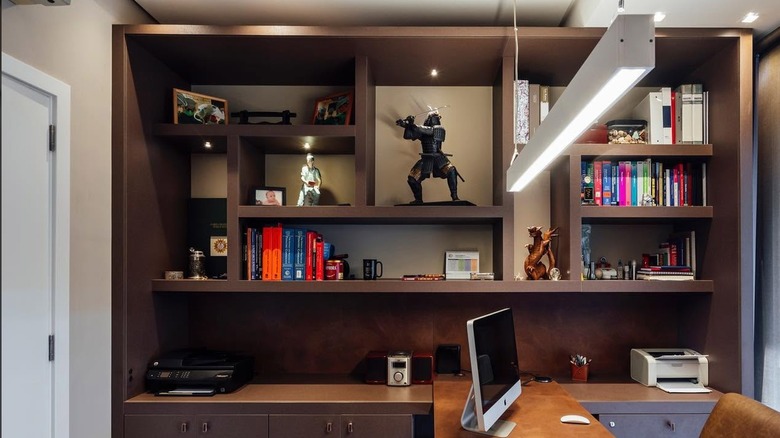 Recessed LED lights in ceiling and a suspended light over home office desk