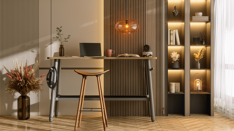 Home office with pendant light hanging over desk