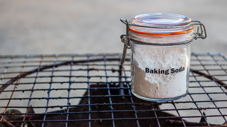 Canister of baking soda on grill