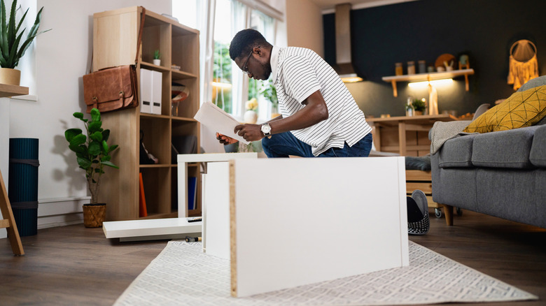 Person assembling IKEA furniture