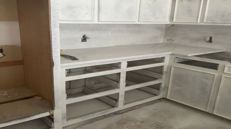 Kitchen with primed cabinets