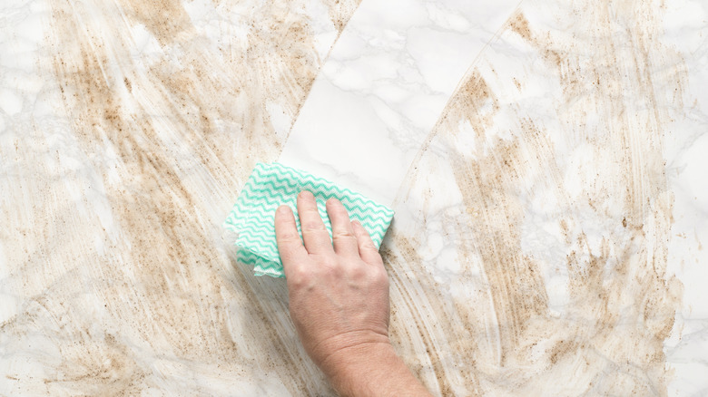 Wiping dirty marble