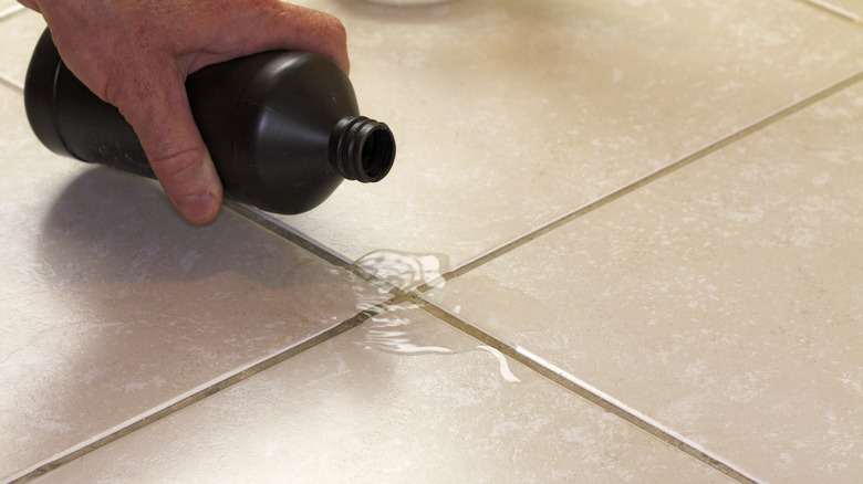 Pouring hydrogen peroxide on grout