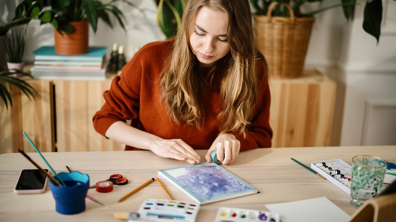 woman blocking watercolor painting