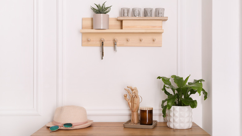 wooden shelf with knobs