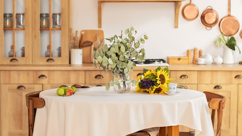 greenery and sunflowers on table