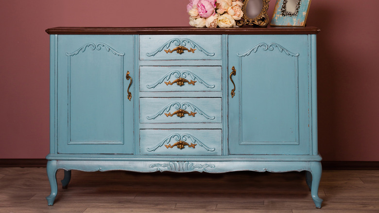 blue dresser in pink room