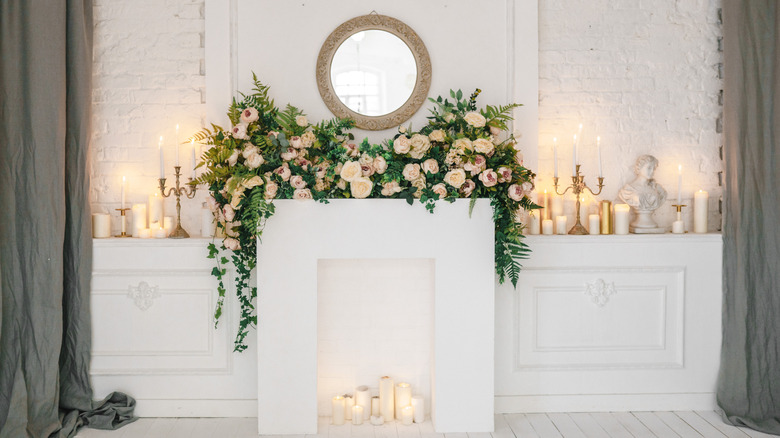 candles inside a white fireplace