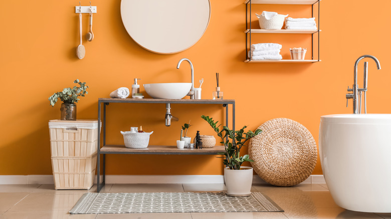 orange bathroom with baskets