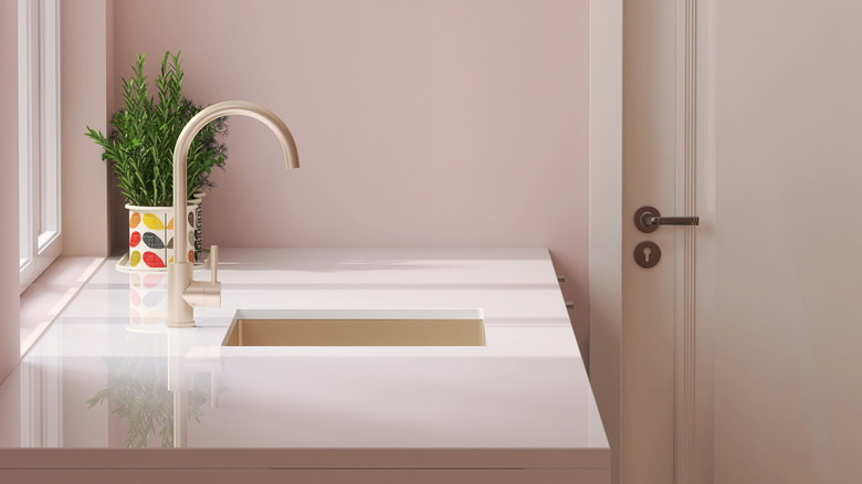 Laminate countertop in pink bathroom 