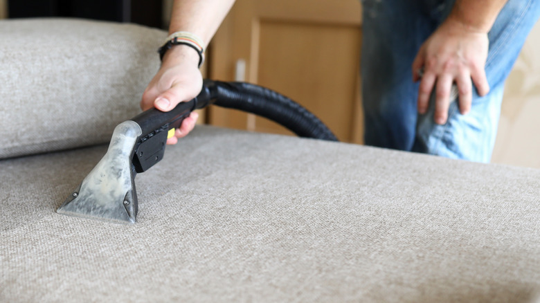 vacuuming couch 