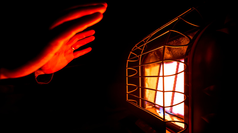space heater glowing on hands