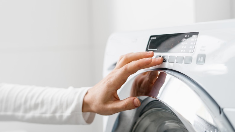 Pushing button on a washing machine