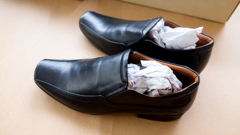 leather shoes stuffed with paper