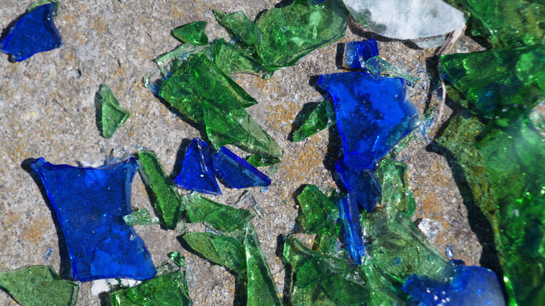 broken pieces of blue and green glass