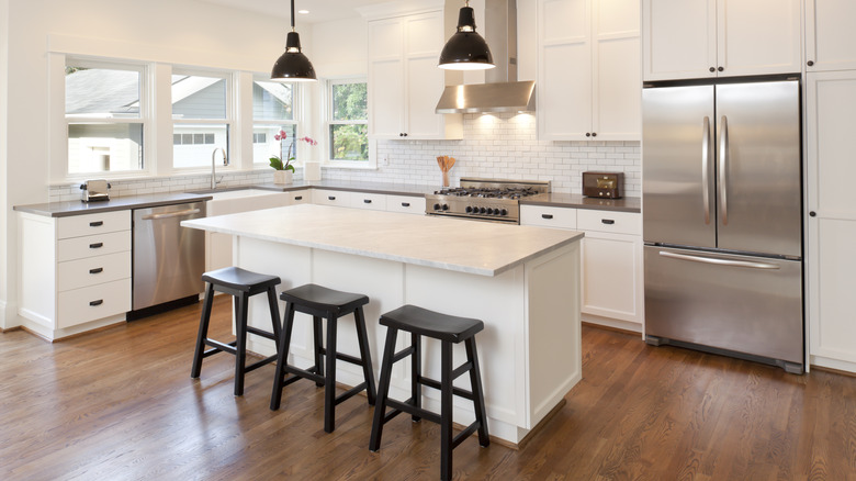 Kitchen with flush countertops and fridge