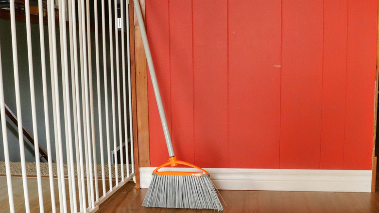 broom near baseboard 