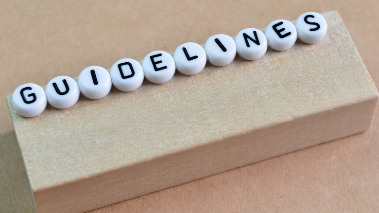 white beads with black lettering