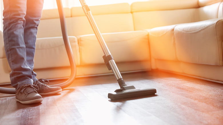 Man vacuuming floor